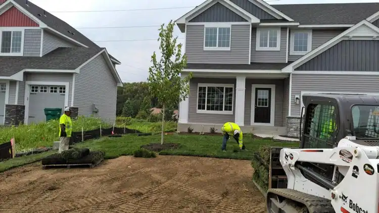 Ristau crew installing sod at a new construction property