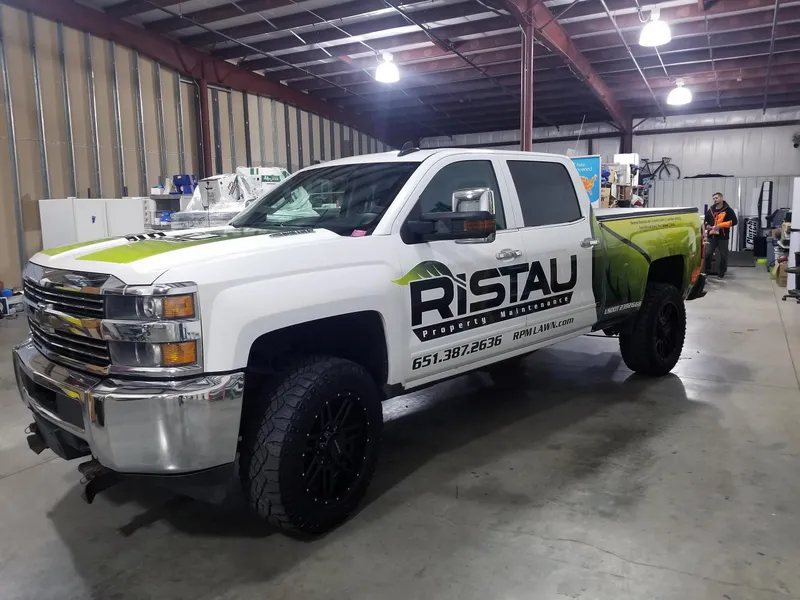 Professional lawn care crew with commercial equipment in the Twin Cities