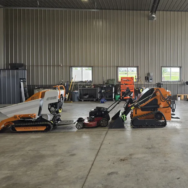 Ristau commercial equipment shop with mowers and compact loaders