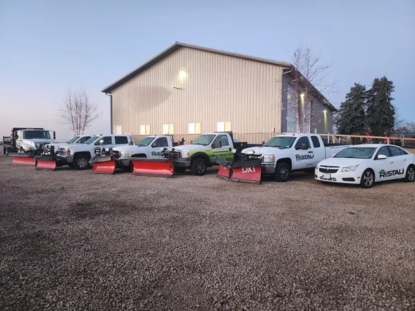 Ristau Property Maintenance plow truck fleet staged before a snow event