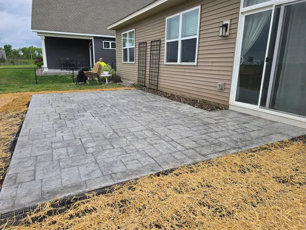 Finished stamped concrete patio at backyard of new construction home